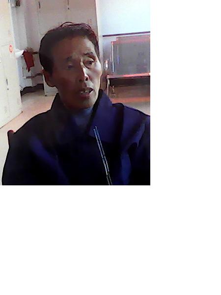 流浪人员路中艳照片，让爱回家