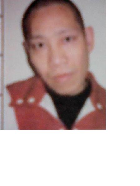 流浪人员谭长平照片，让爱回家